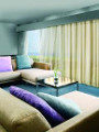 Motorized curtain hotel